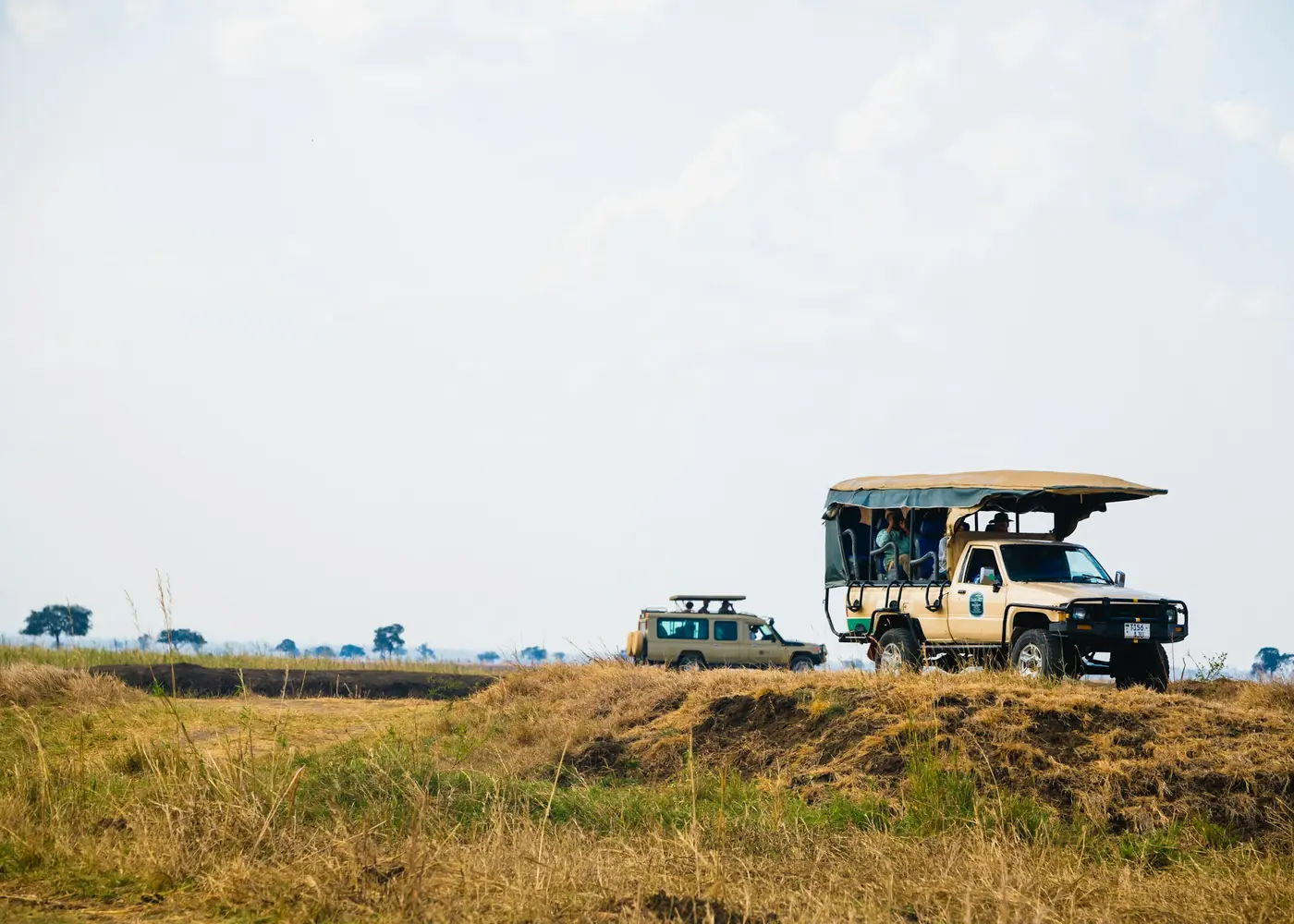 A safari vehicle crossing the plain